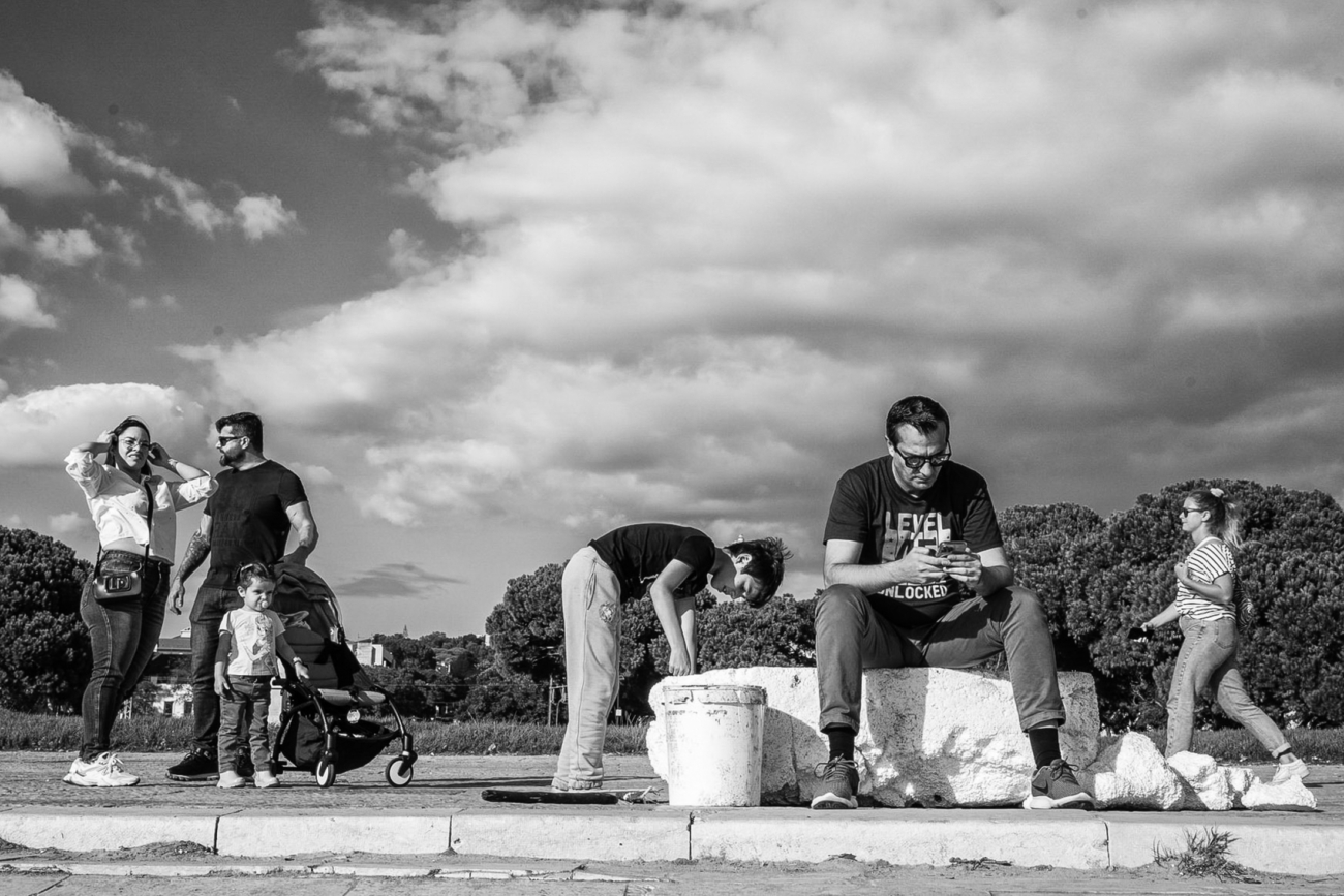 Lisbon street photography guide 21 Locals enjoy the sun at Belem tower
