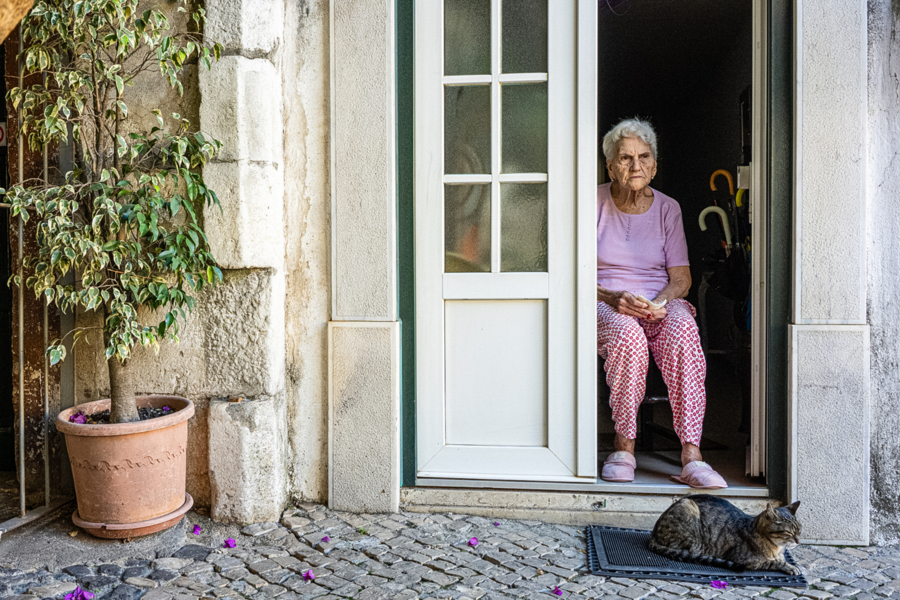 Lisbon street photography guide 30 A local Portuguese lady with her cat in Lisbon