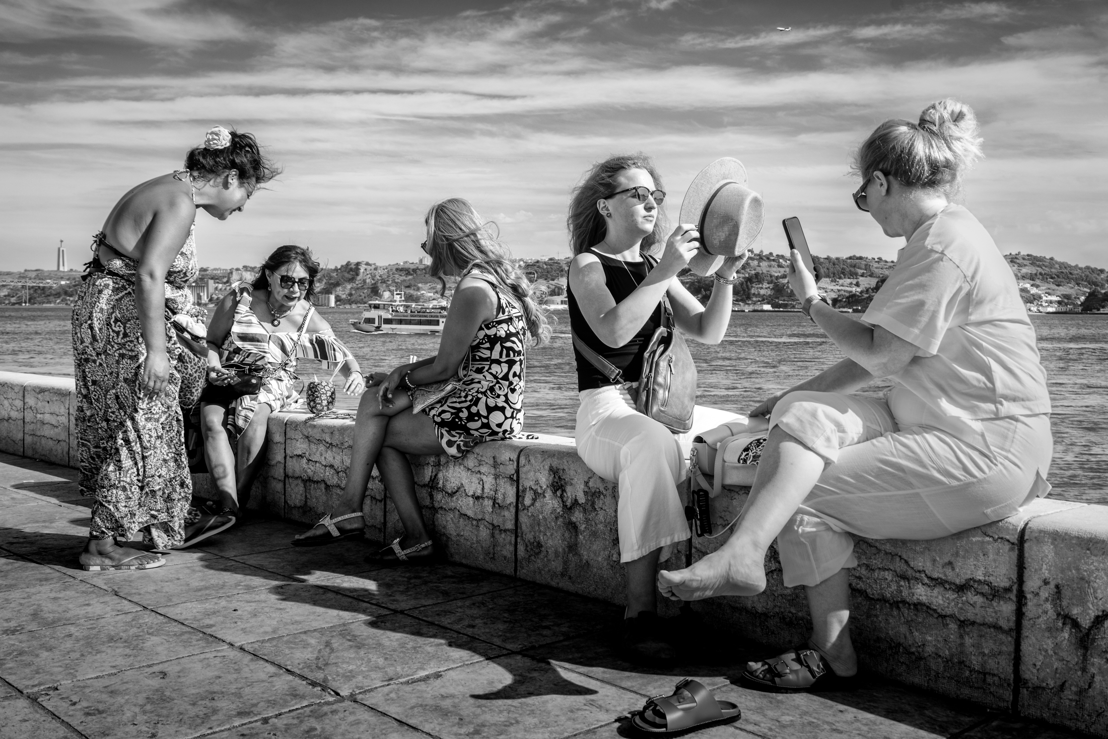 Lisbon street photography guide 18 A local street seller sells jewellery to tourists in Lisbon