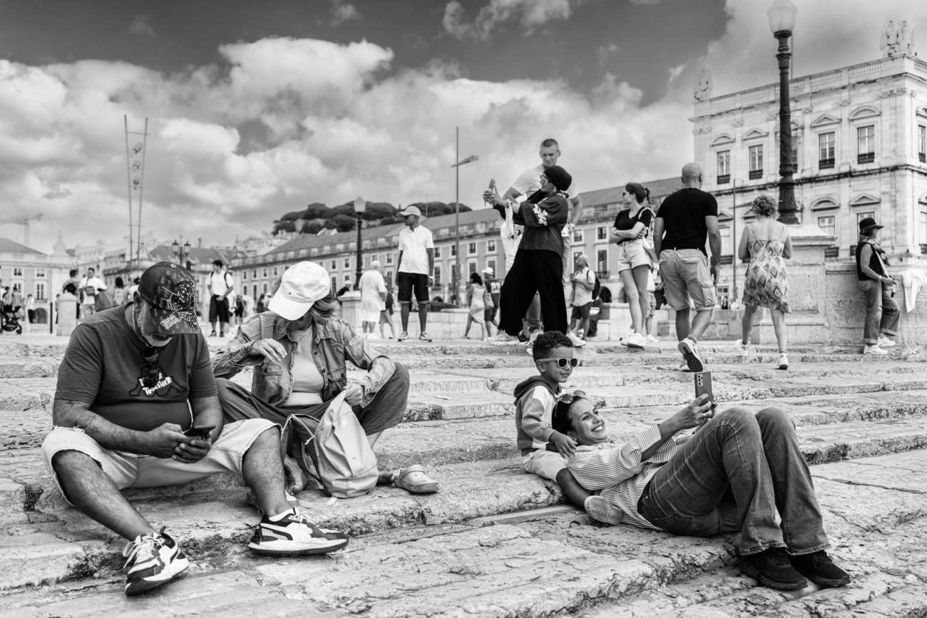 Lisbon street photography guide 12 Mum and son enjoying a moment by the river in Lisbon