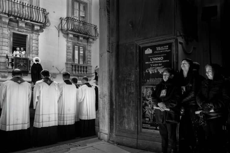 Marks Journal 1 Worshippers dressed in black stand beside priests in white robes outside the Church of the Souls in Purgatory as a bishop addresses the crowd from a balcony above during the closing ceremony.