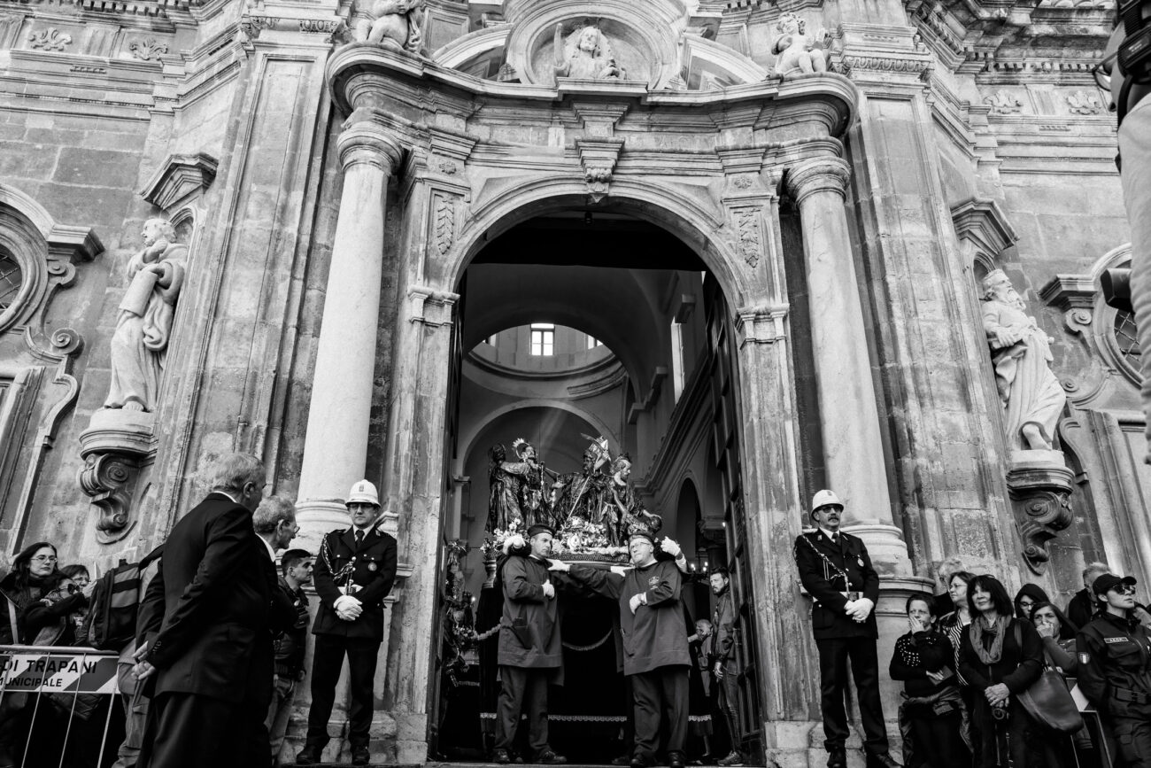 Inside the Misteri di Trapani: Documenting Sicily’s Living Tradition 12 A sacred group pauses in the doorway of the Church of the Anime Sante before entering the streets for the Misteri di Trapani procession in Trapani, Sicily.
