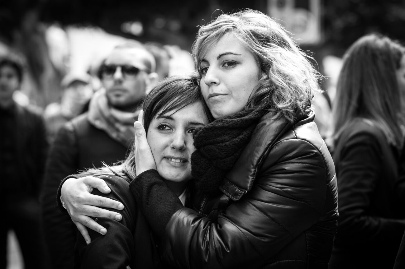 Inside the Misteri di Trapani: Documenting Sicily’s Living Tradition 20 Two women embrace as they watch the Misteri di Trapani procession in Trapani, Sicily.