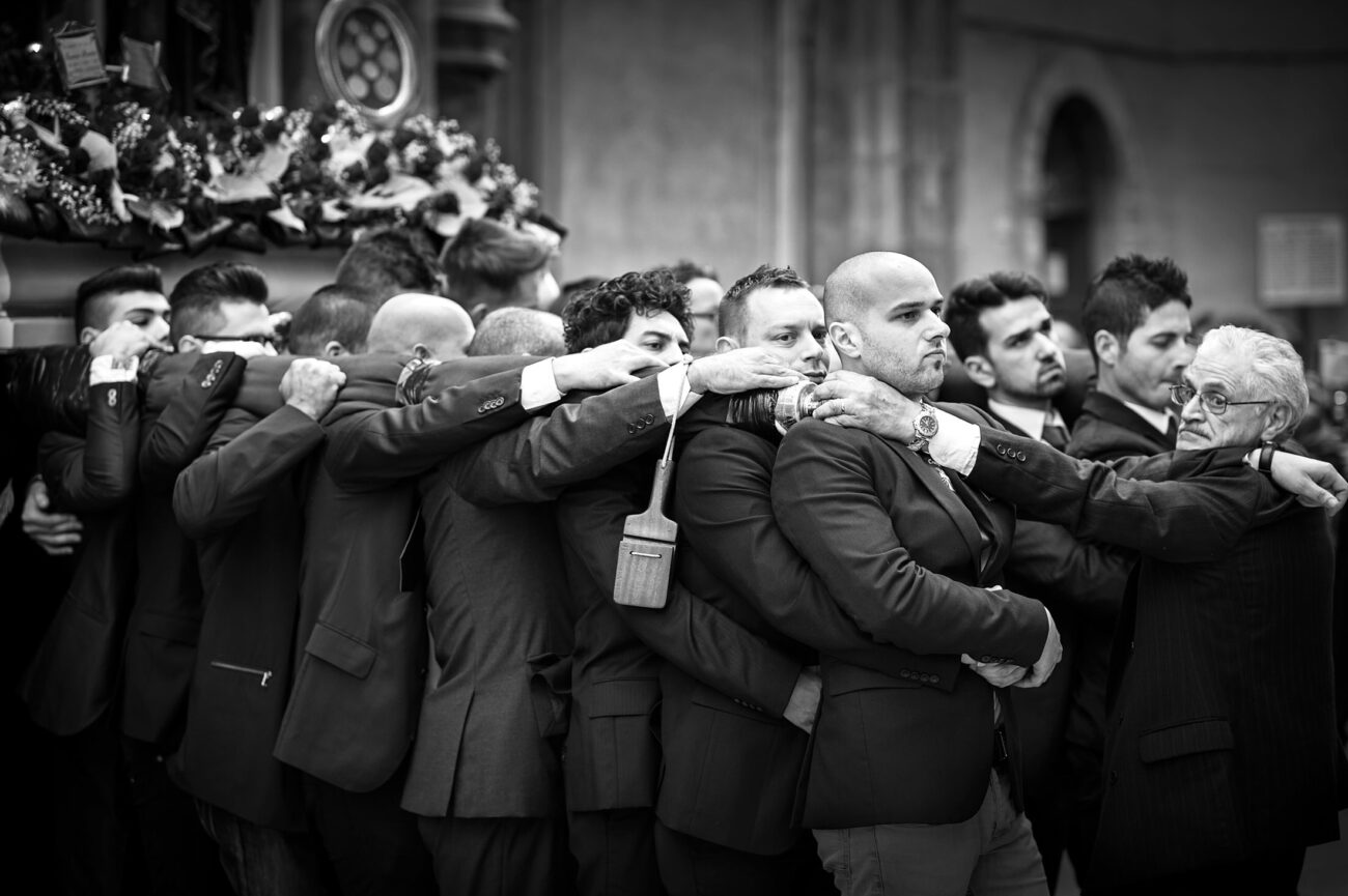 Inside the Misteri di Trapani: Documenting Sicily’s Living Tradition 11 Bearers carrying one of the sacred groups through the streets of Trapani during the Misteri di Trapani procession, with younger and older generations working together.