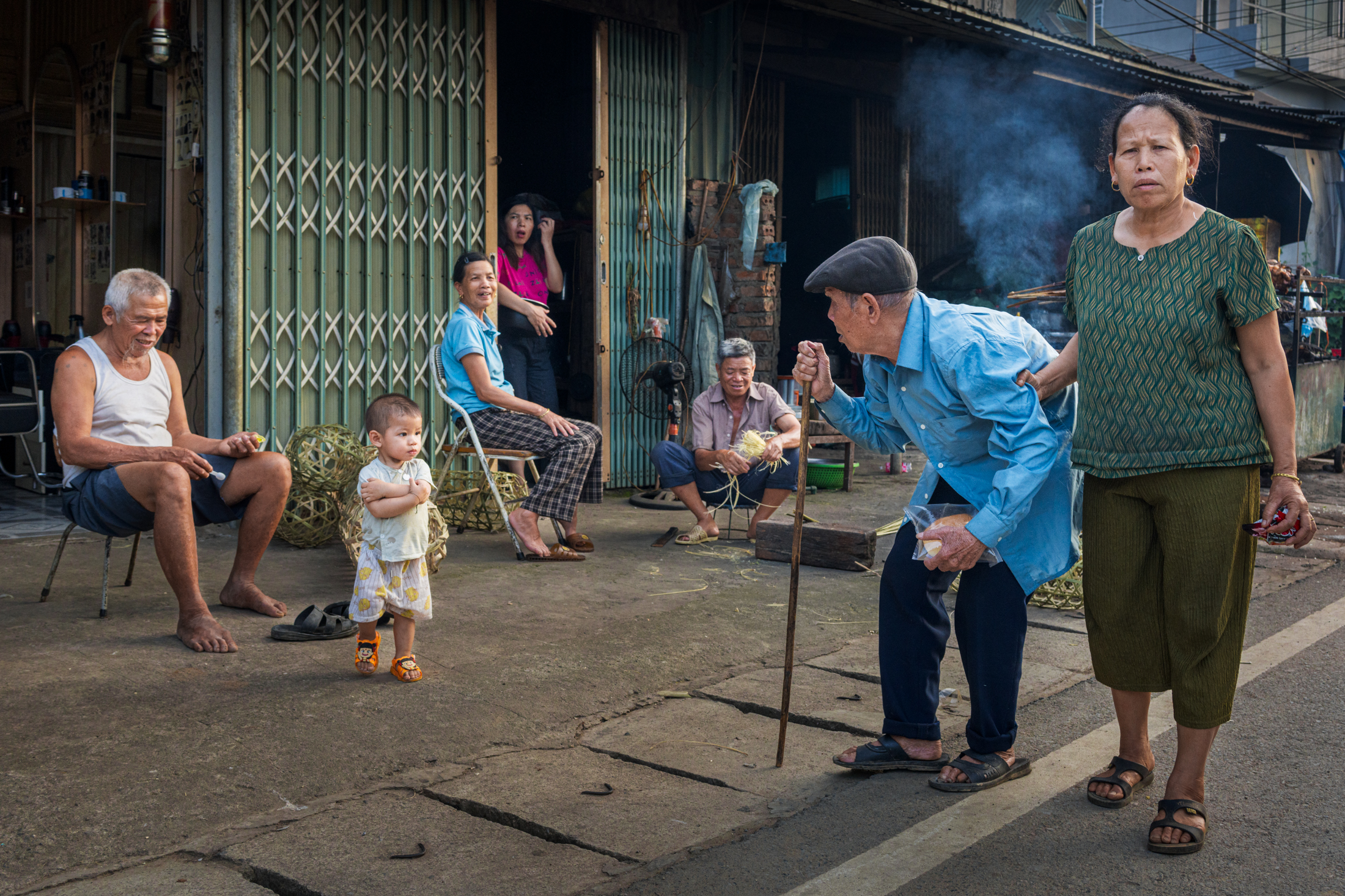 Northern Vietnam Photography: A Photographer’s Journey Beyond the Tourist Trail 12 Residents gather outside their homes in a neighbourhood in northern Vietnam as daily life unfolds on the street.